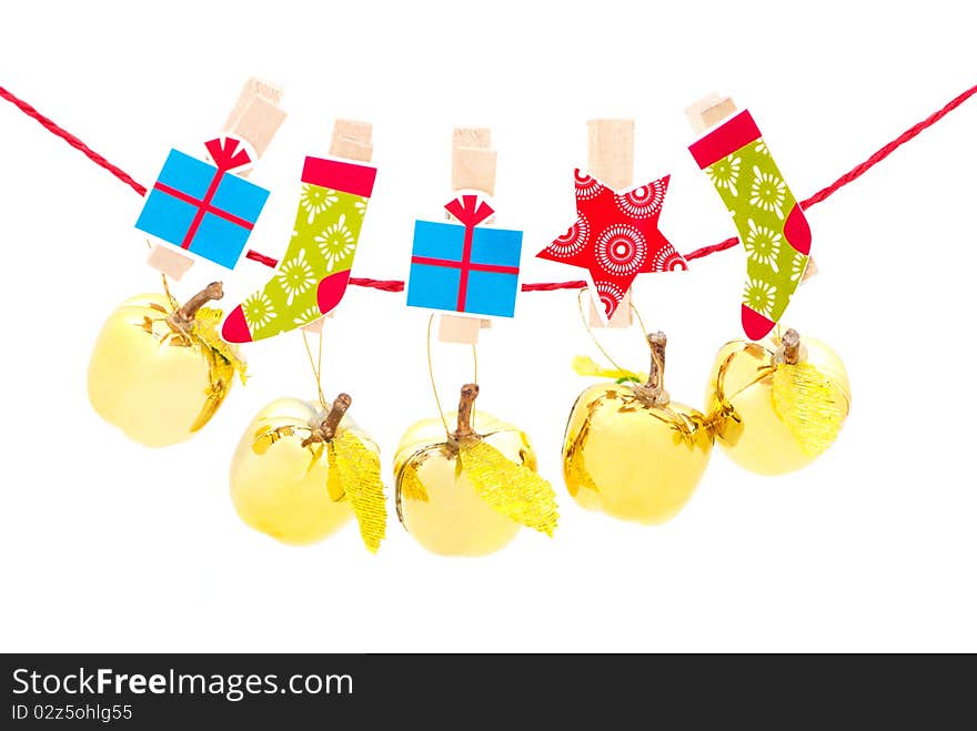 Christmas decorations - golden apples hanging in a row