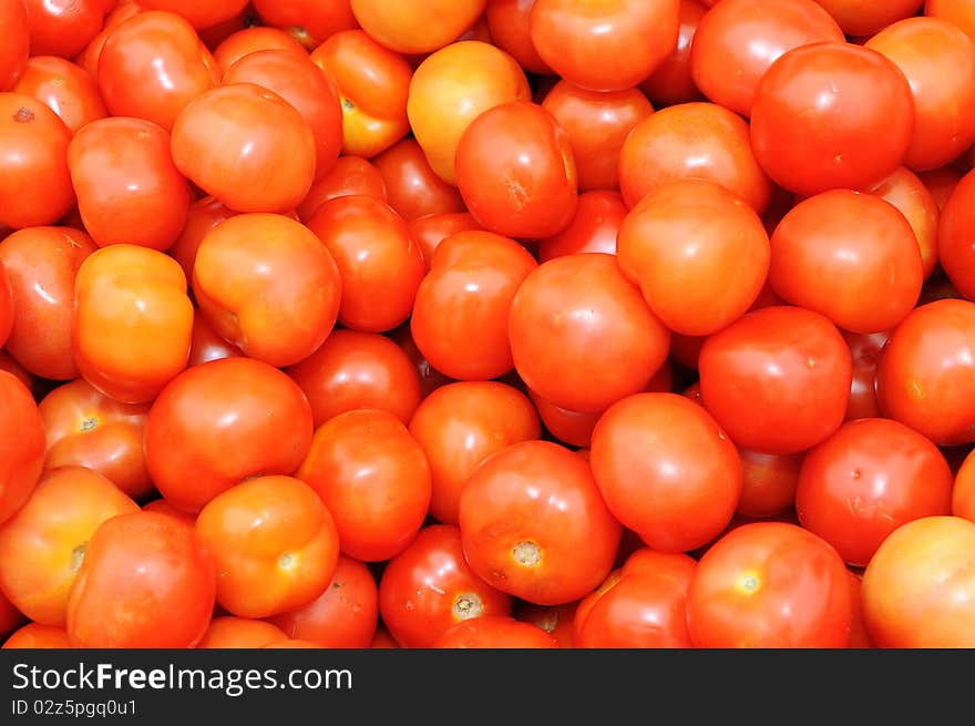 A Background Of Ripe Tomatoes At A Market Stall