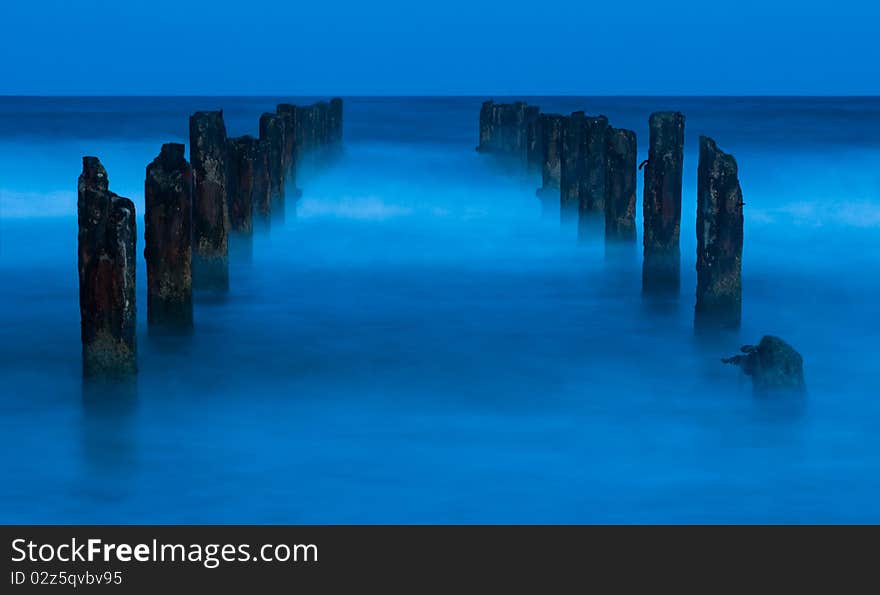 A ruined Pier  at night