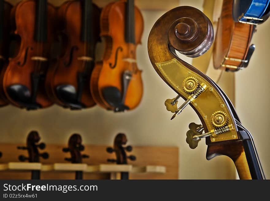 Close up of a cello with viola background