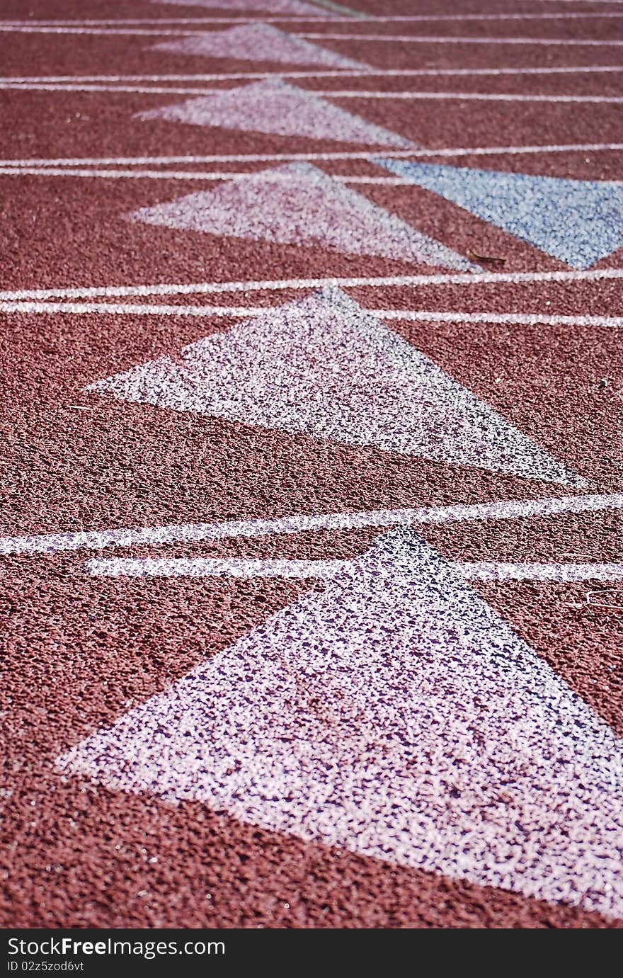 Stadium, a racetrack brown of artificial turf for sports.