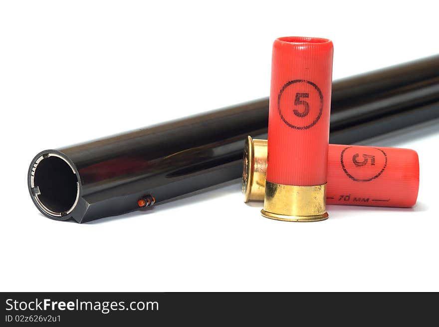 Barrel shotgun and cartridges on a white background. Barrel shotgun and cartridges on a white background.