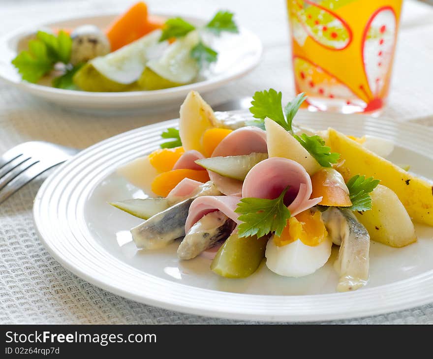 Salad from potato, cucumber, egg and carrot for dinner