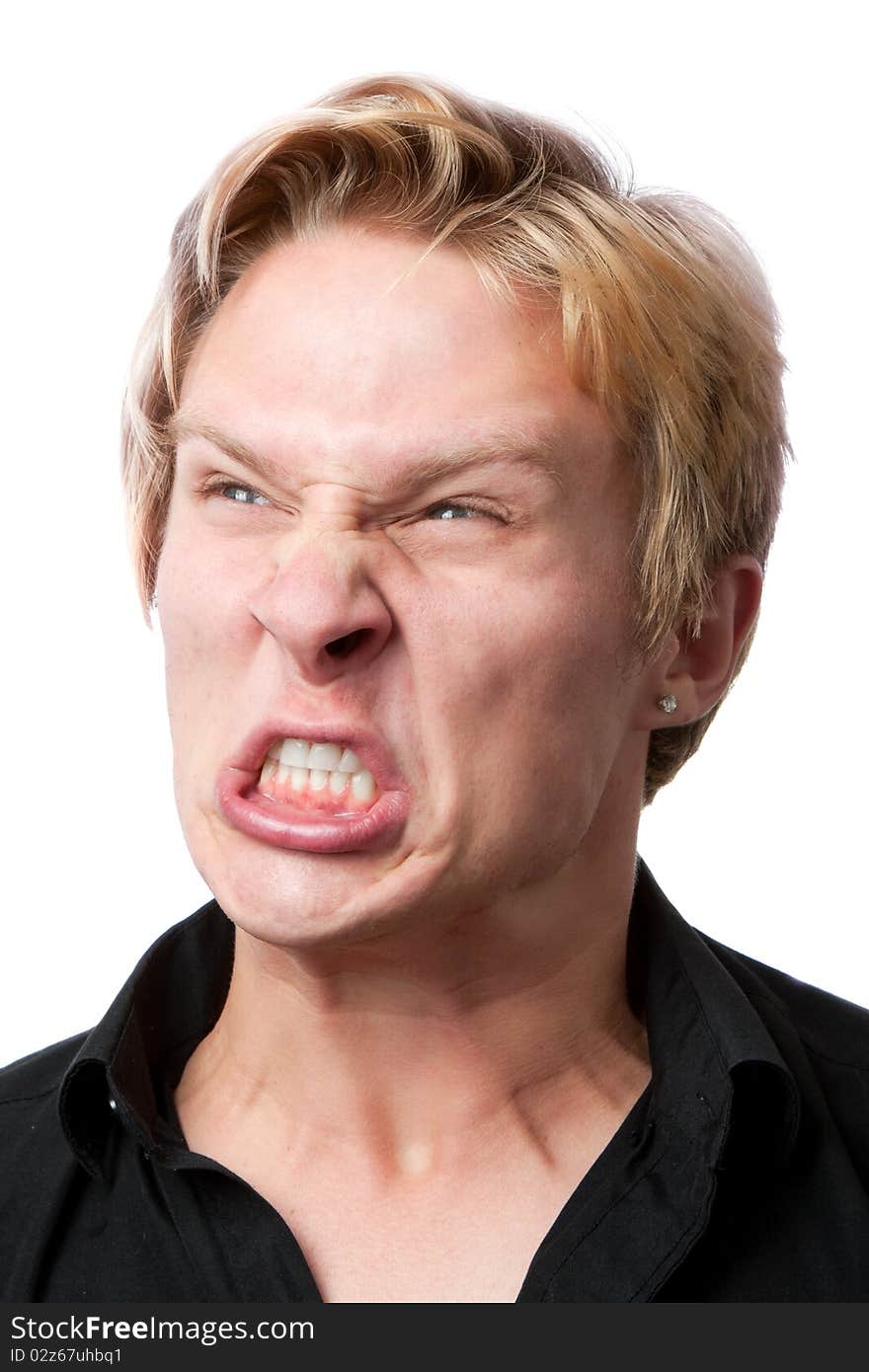 Closeup of furious young man on white background