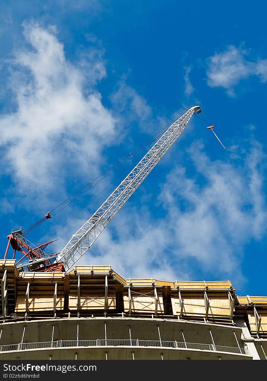 Condominium tower under construction with crane. Condominium tower under construction with crane