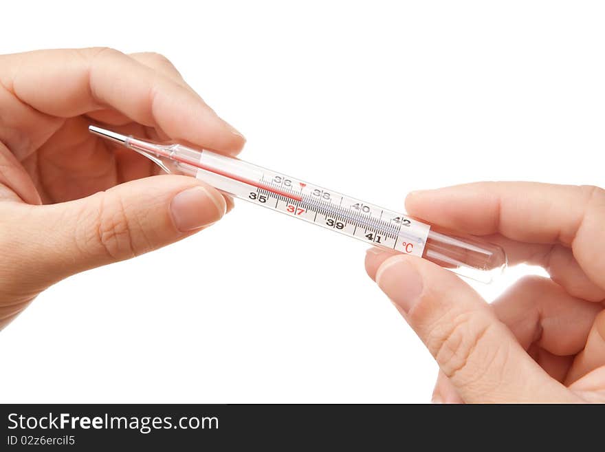 Hands holding thermometer showing 37'C, isolated on white