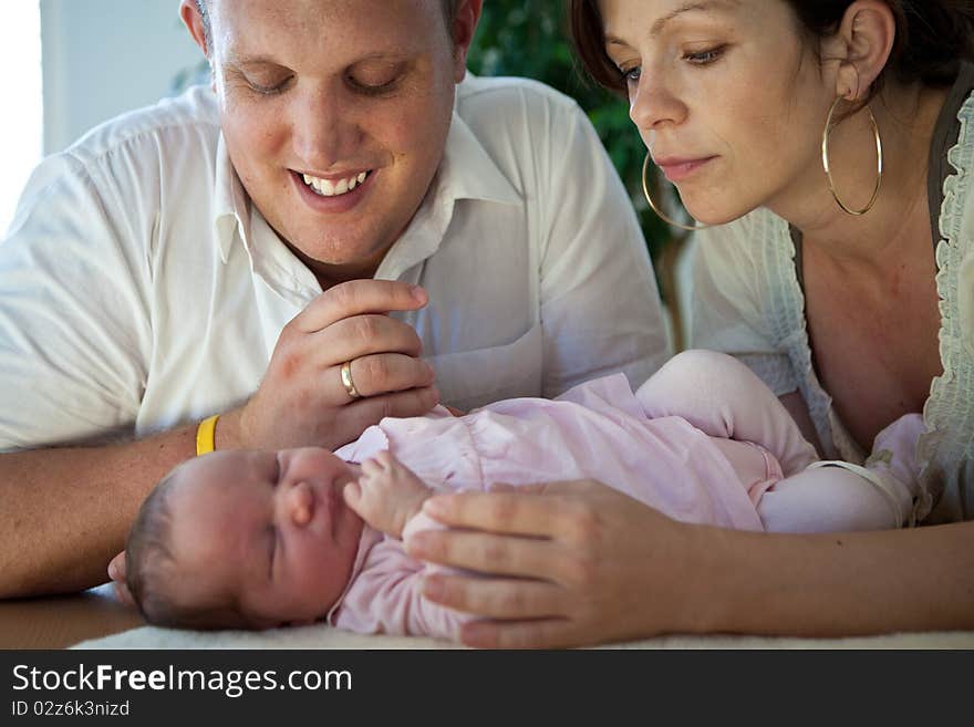 Young couple with their baby girl. Fresh happy family. Young couple with their baby girl. Fresh happy family.