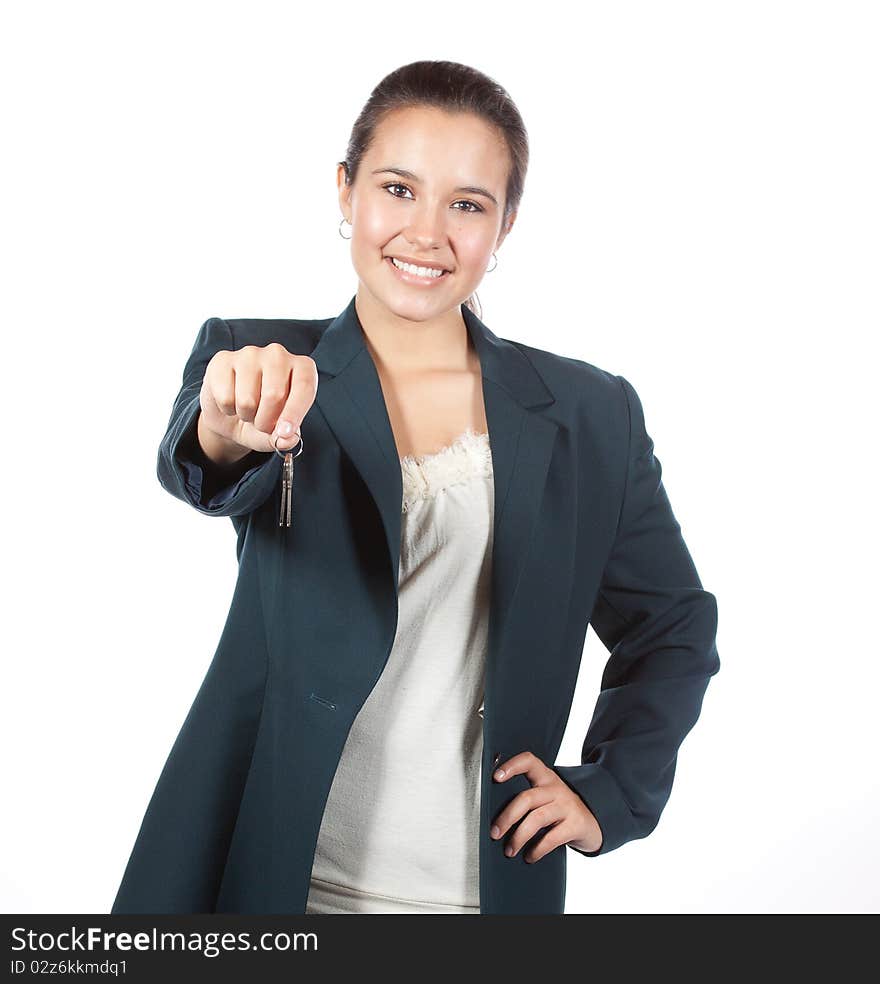 Fresh face, young hispanic woman handing a set of house keys to the viewer. Fresh face, young hispanic woman handing a set of house keys to the viewer