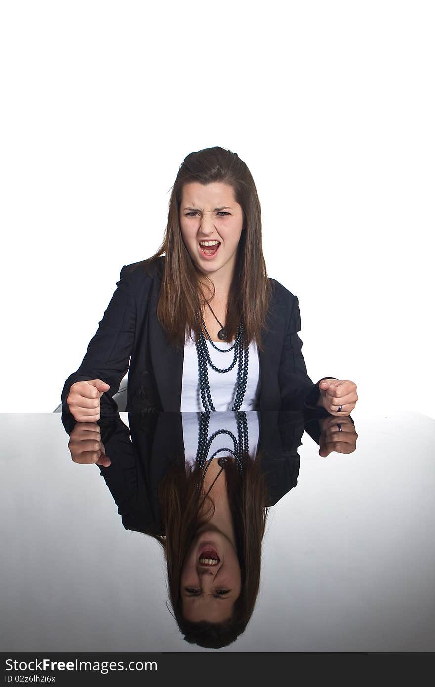 Young business teenage girl sitting at a mirror table. Young business teenage girl sitting at a mirror table.