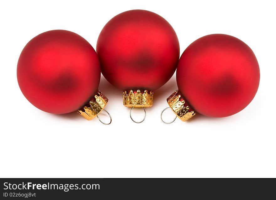 Red lovely Christmas baubles isolated on white background. For Christmas and new year decorations. Red lovely Christmas baubles isolated on white background. For Christmas and new year decorations.