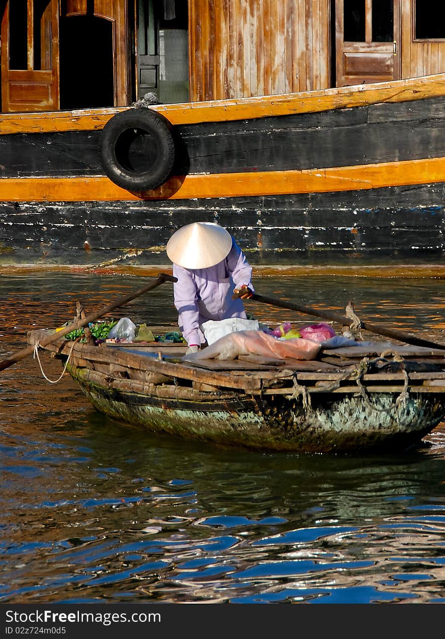 Woman on boat, floating market