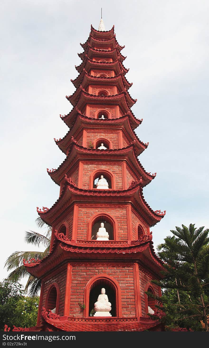 Buddhist, pagoda temple tower with Buddha statues. Buddhist, pagoda temple tower with Buddha statues