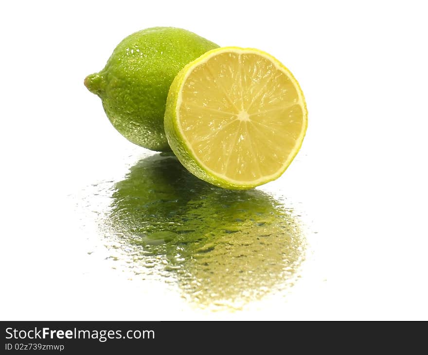 Citrus fruits on the white background with water drop