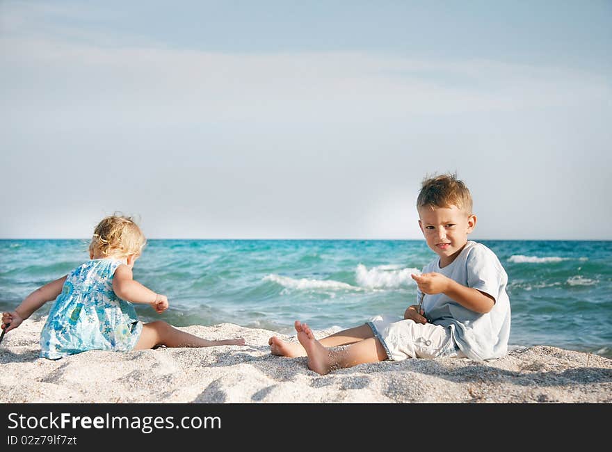 Two children playing on beach