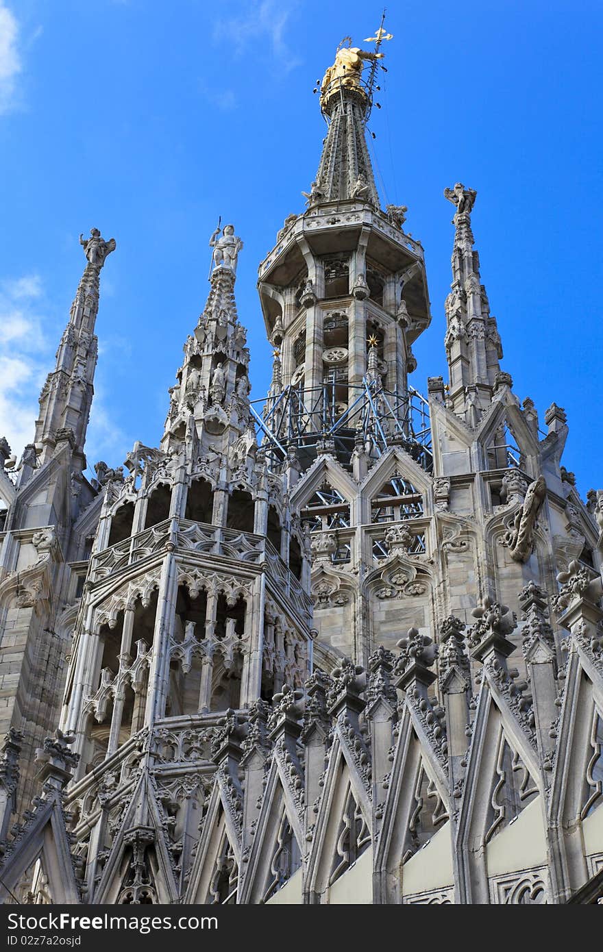 The central spire of a cathedral Duomo, Milan