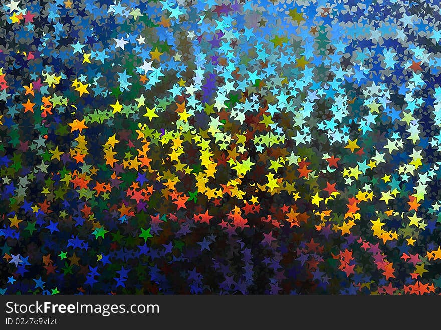 Enlarged fragment of an abstract background with multicolored stars. Enlarged fragment of an abstract background with multicolored stars.