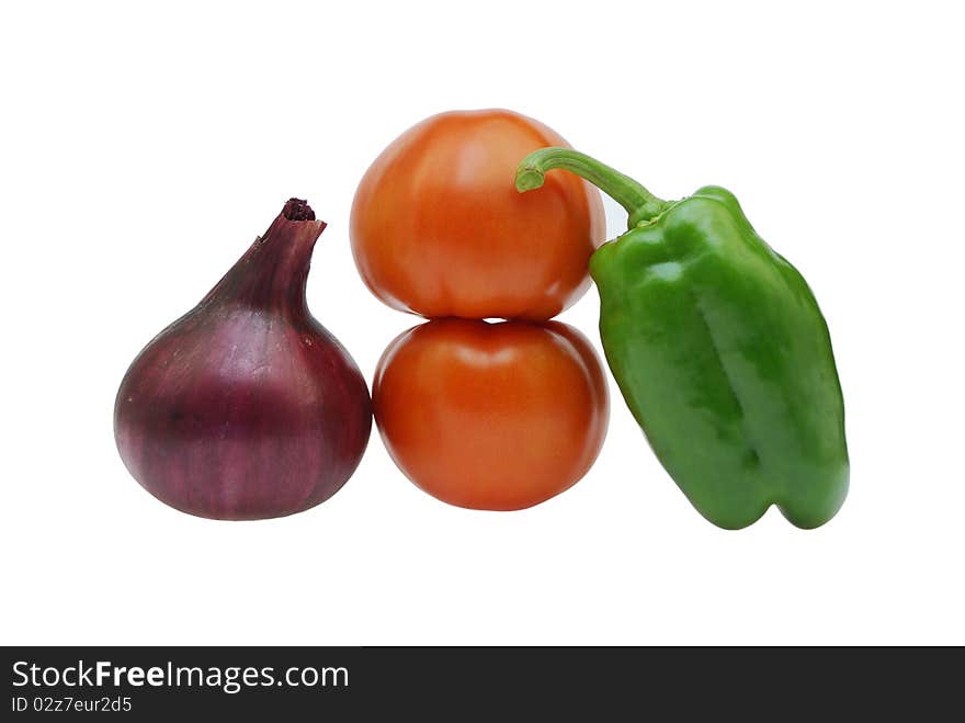 Multi-coloured vegetables on a white background. Multi-coloured vegetables on a white background