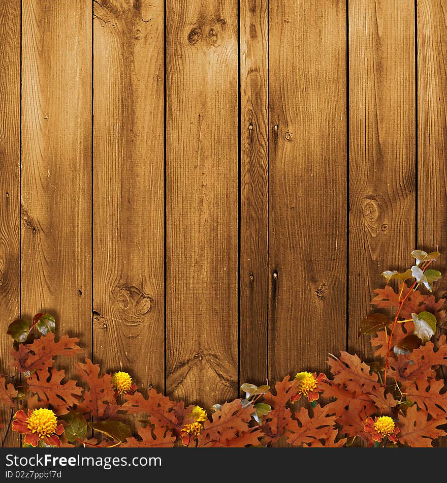 Card for the holiday with autumn leaves on the wooden background. Card for the holiday with autumn leaves on the wooden background