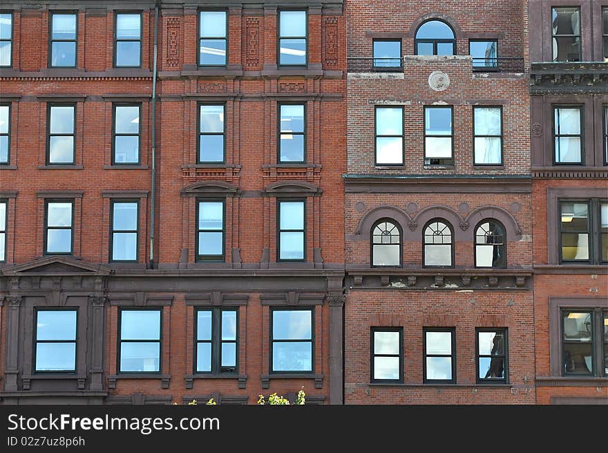 Bricks facade with windows in old traditional building of Boston, Massachusetts, United States. Bricks facade with windows in old traditional building of Boston, Massachusetts, United States