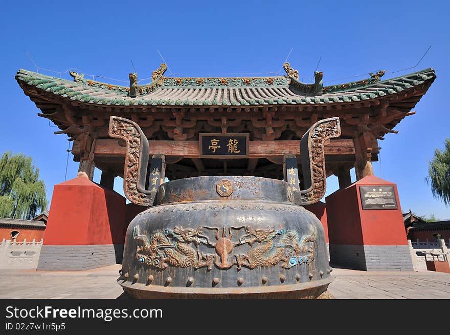 Old Chinese temple and featured censer for sacrifice rive, shown as traditional architecture style and historic feature. Old Chinese temple and featured censer for sacrifice rive, shown as traditional architecture style and historic feature.