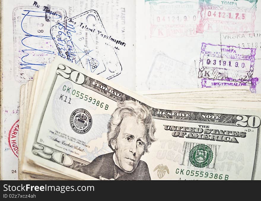 Stamped passport with dollars - travel concept -. Stamped passport with dollars - travel concept -