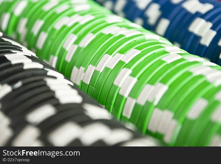 Casino gambling chips in three colors background