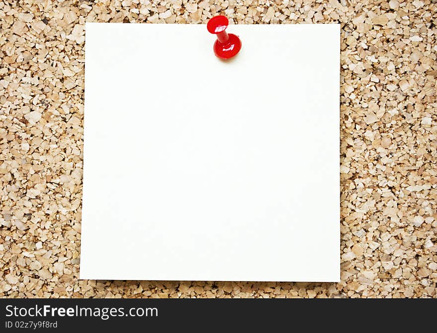 Blank paper note on cork board