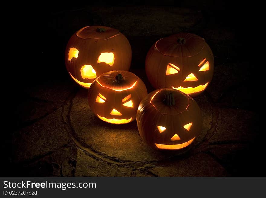 A group of Pumkins, Illuminated by candles & photographed at night. A group of Pumkins, Illuminated by candles & photographed at night