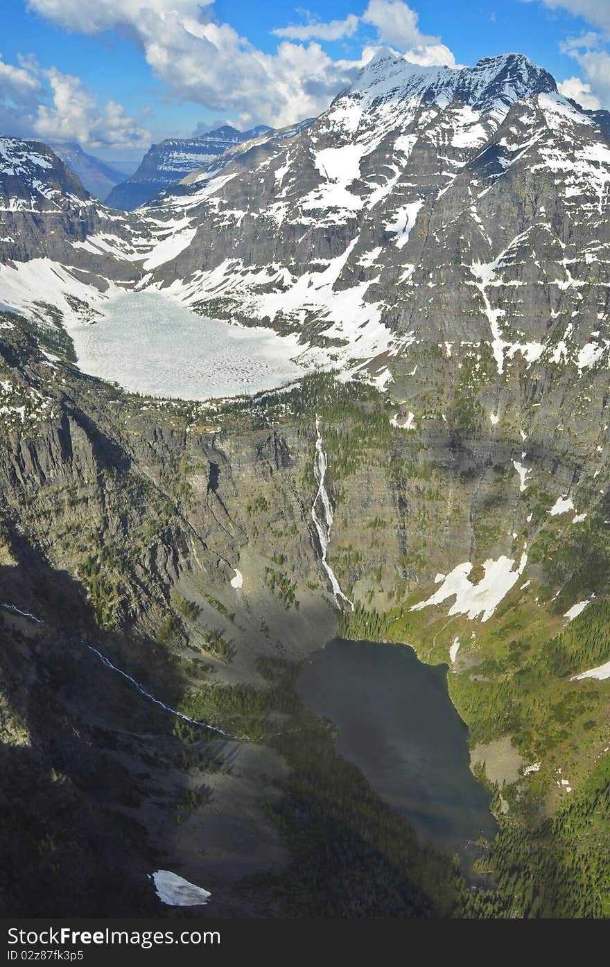 Aerial view of one lake flowing into another. Glacier National Park, Montana. Aerial view of one lake flowing into another. Glacier National Park, Montana