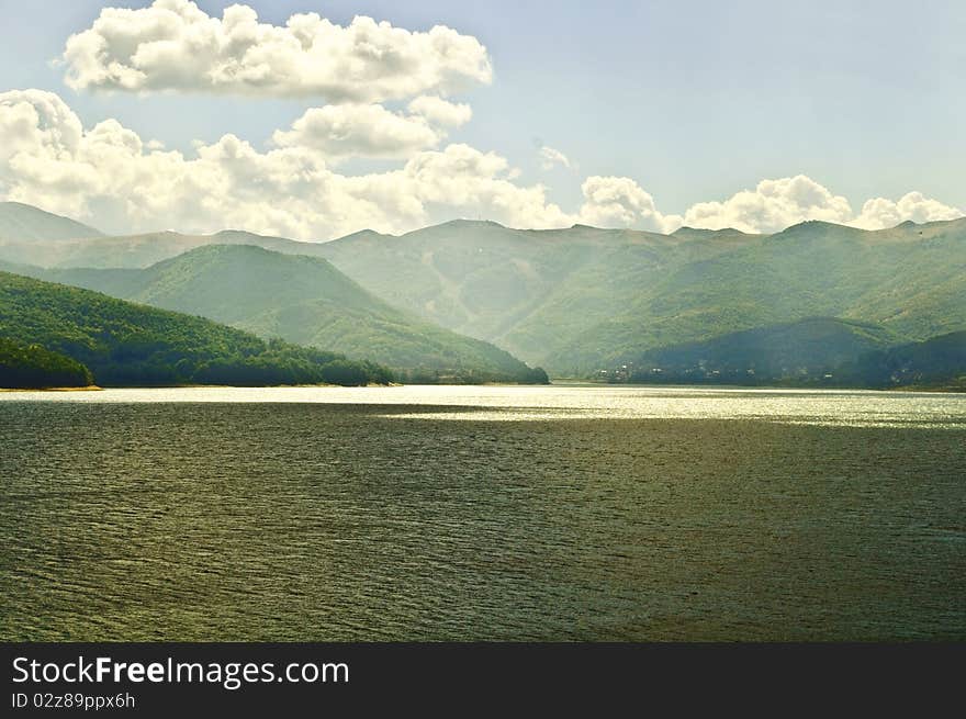 Landscape of lake and forest with sun rays. Landscape of lake and forest with sun rays