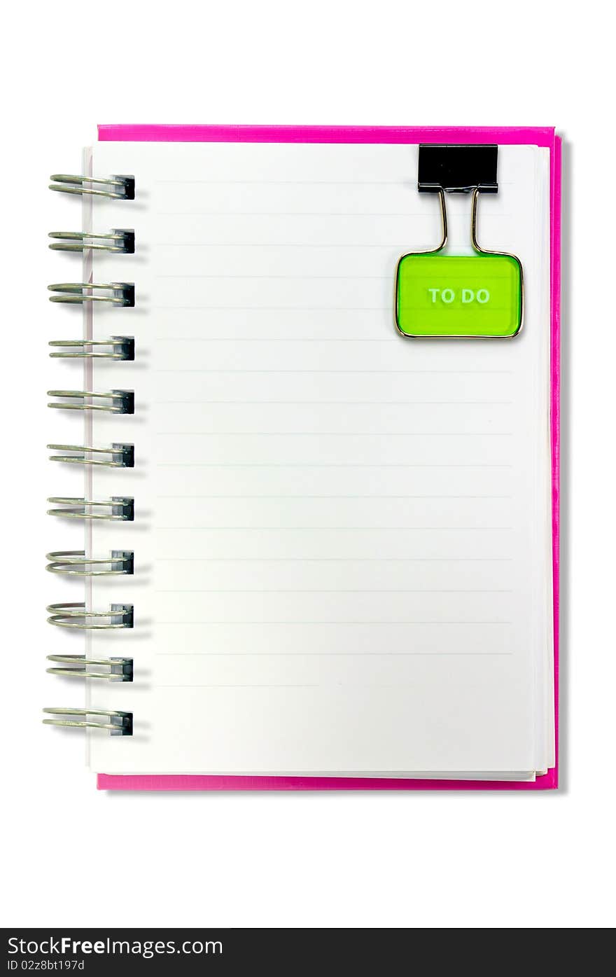 A blank notebook with a yellow clip . The clip is positioned in a top position. Isolated on a white background. A blank notebook with a yellow clip . The clip is positioned in a top position. Isolated on a white background.