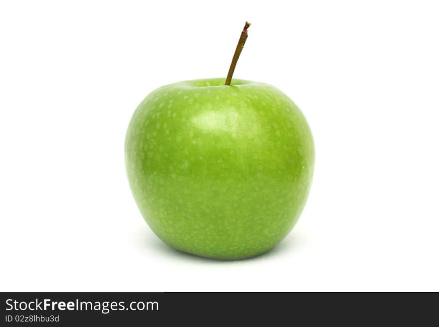 Close up of a green apple isolated on white background.