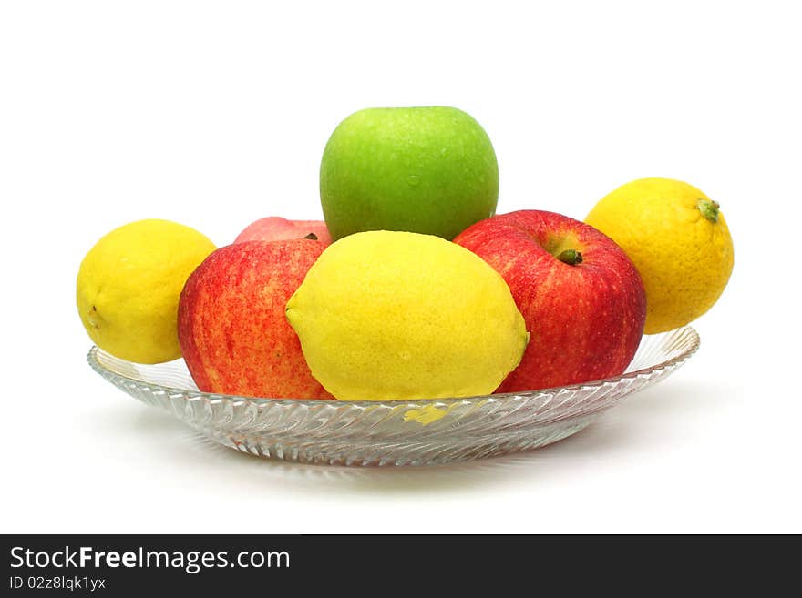 Close up of a pile of mixed fruits isolated over white background.