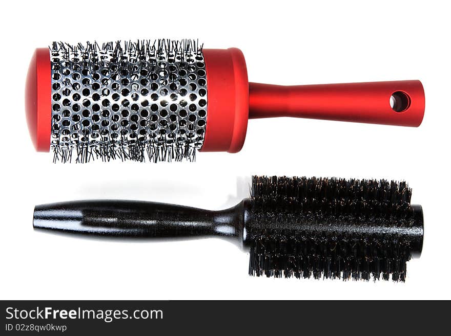 Two red massages comb on white background