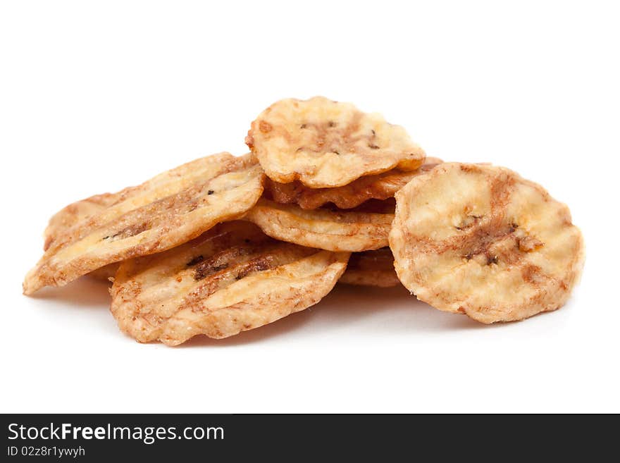 Banana slices in caramel isolated on white background