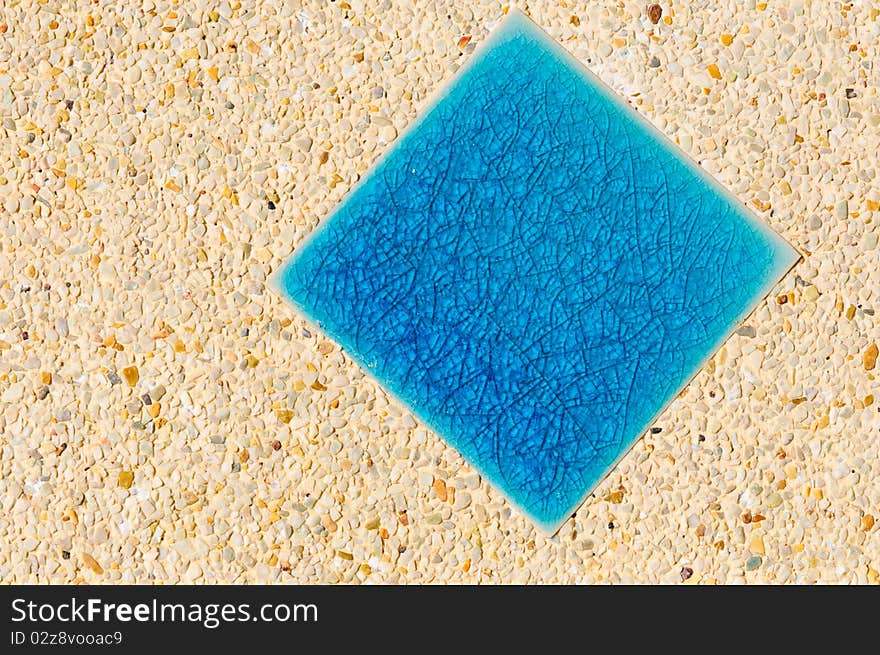 Blue tiles with brown background in pool