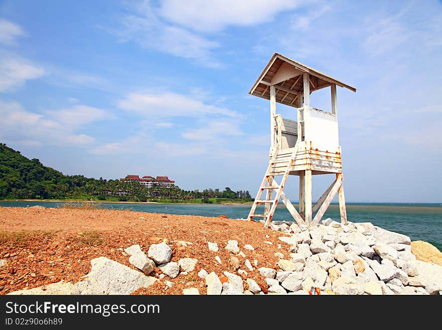 Beach life guard tower on dry meadow at Rayong beach in Thailand