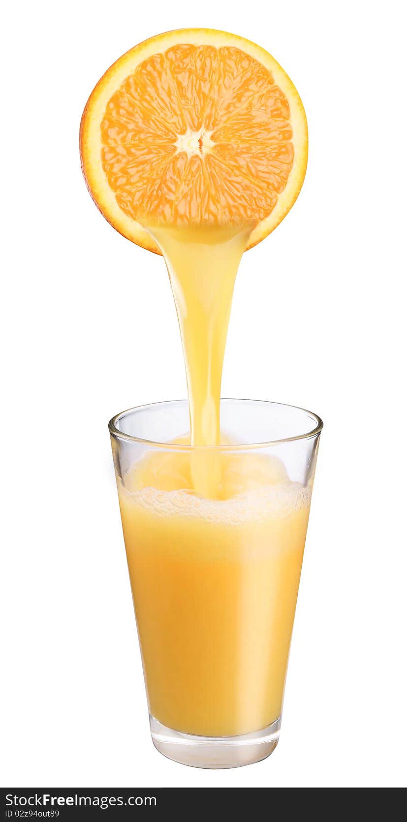 Juice flowing from orange into the glass. Juice flowing from orange into the glass.