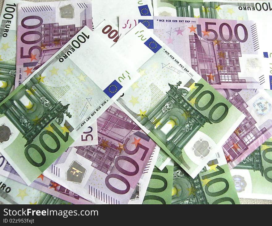 Background of scattered 100 and 500 euro banknotes. Background of scattered 100 and 500 euro banknotes