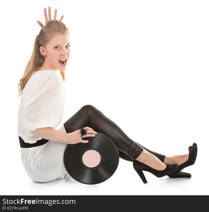 Young girl with a vinyl record on white background