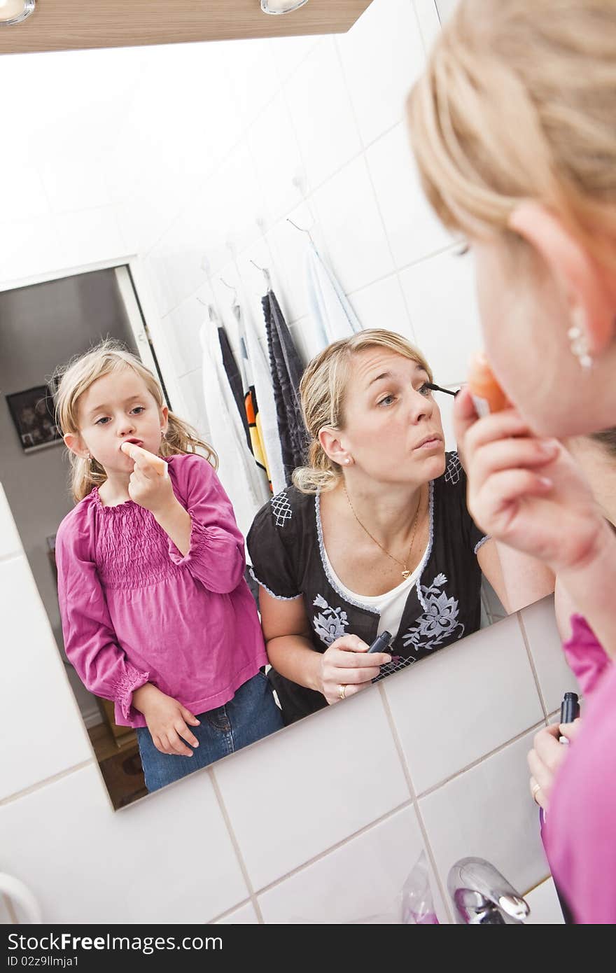 Mother and Daughter put on make-up