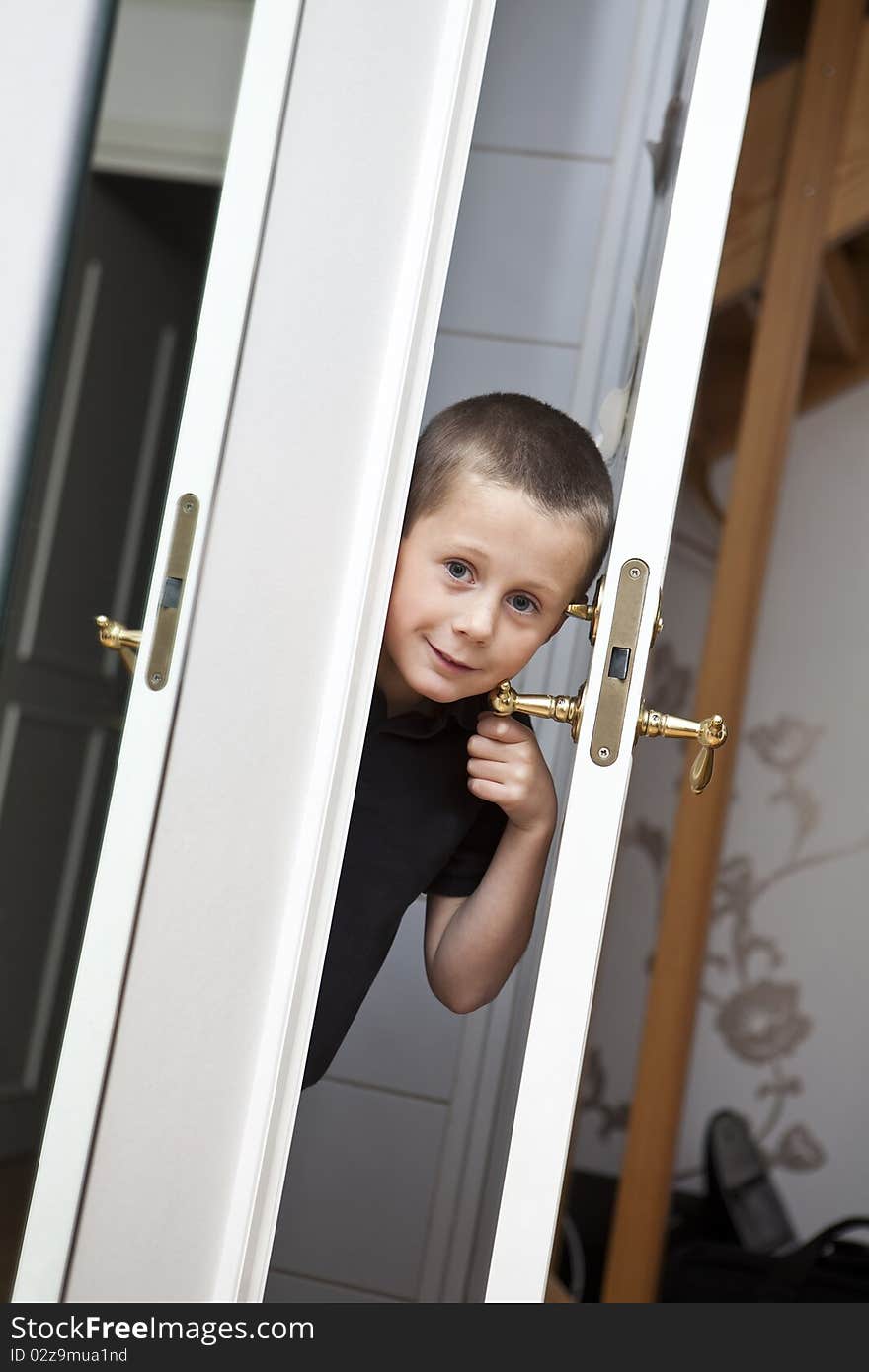 Little Boy looking out from the Closet. Little Boy looking out from the Closet