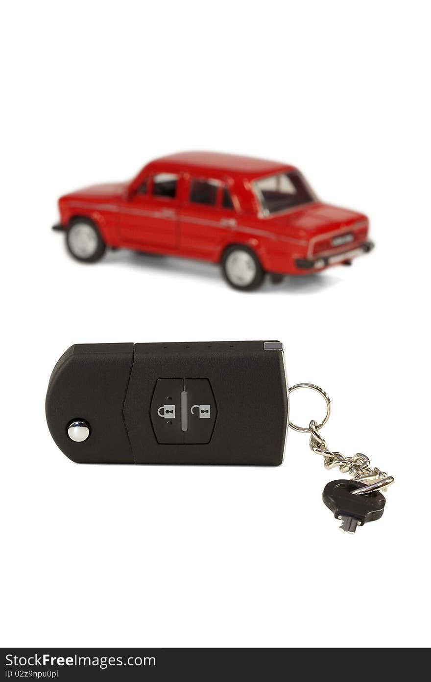 A set of car keys on the background of a model car. A set of car keys on the background of a model car