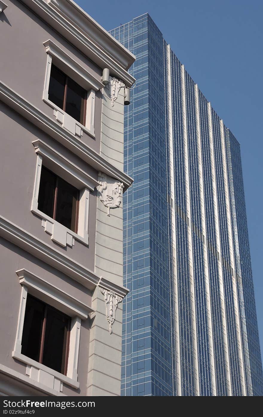 Skyscraper and  old building