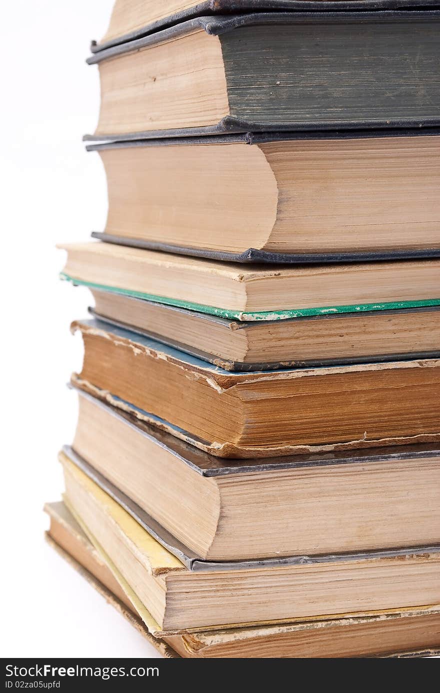 Pile of old books on white