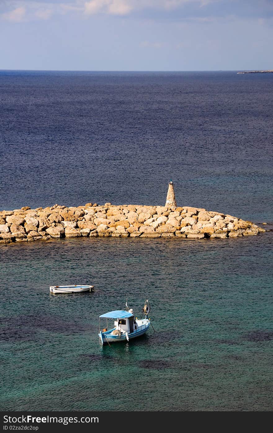 Fishing boats and lighthouse