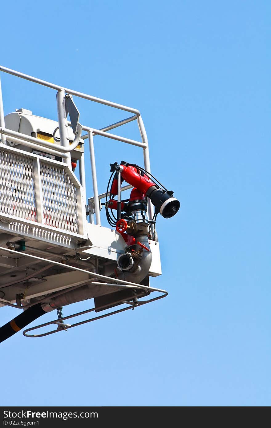 Articulated aerial hydraulic platform against a blue sky