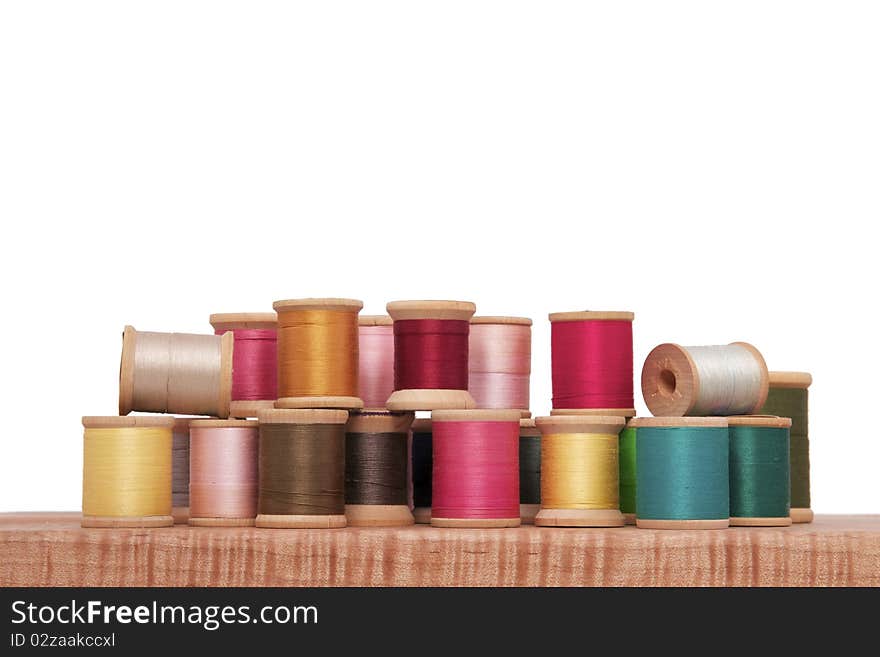 Various Spools of Colorful Thread on a White Background. Various Spools of Colorful Thread on a White Background