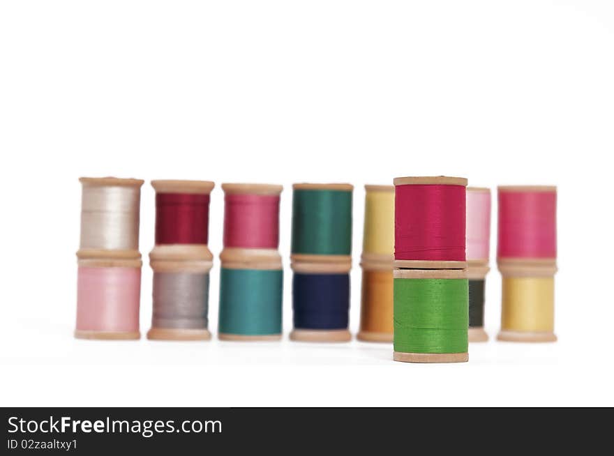 Various Spools of Colorful Thread on a White Background. Various Spools of Colorful Thread on a White Background