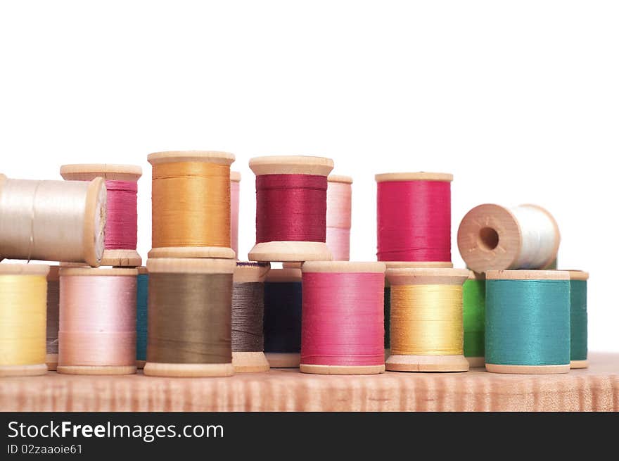 Various Spools of Colorful Thread on a White Background. Various Spools of Colorful Thread on a White Background